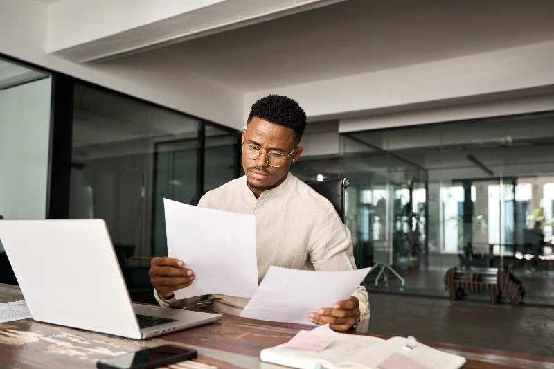 Underwriter reviewing loan docs