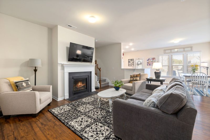 Spacious living room featuring a fireplace and TV