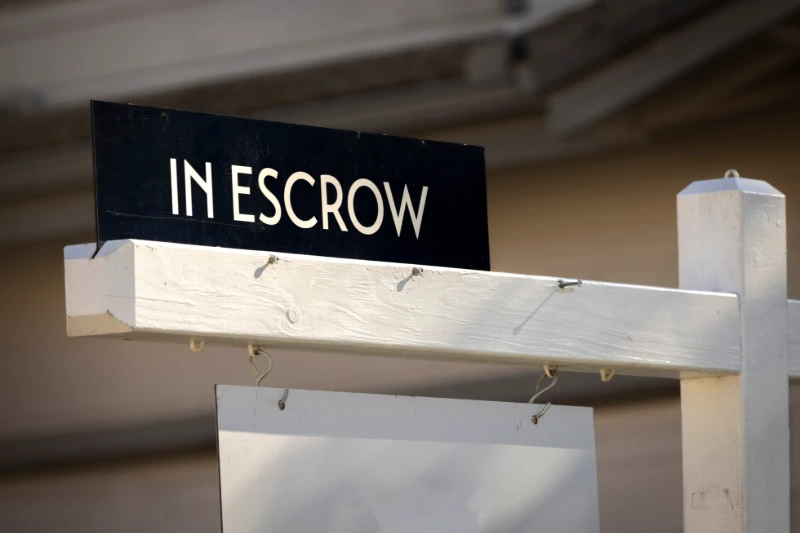 in escrow sign